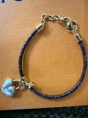 Louis Vuitton canvas monogram, heart charm bracelet with box,dust & shopping bag